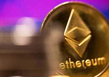 FILE PHOTO: A representation of virtual currency Ethereum is seen in front of a stock graph in this illustration taken February 19, 2021. REUTERS/Dado Ruvic/Illustration