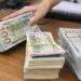 Dollar dips against dong, hovers near 3-month high globally