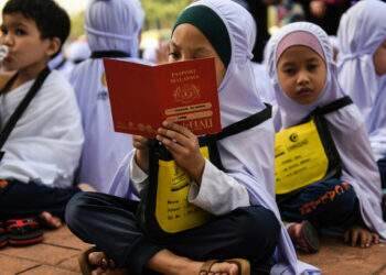 Malaysia gives each student $33 in school aid