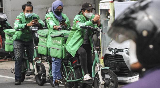 Grab, Gojek parent eye merger this year