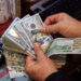 Dollar strengthens against dong despite global slip