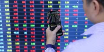 Stocks tumble sharply after reaching historic peak