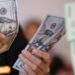 Tỷ giá trung tâm lao dốc, giá chợ đen bán ra 26.440 đồng/USD