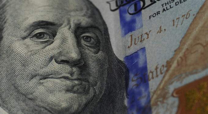 Black market dollar edges down against dong
