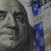 Black market dollar edges down against dong