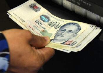 Who appears on all Singapore dollar banknotes?