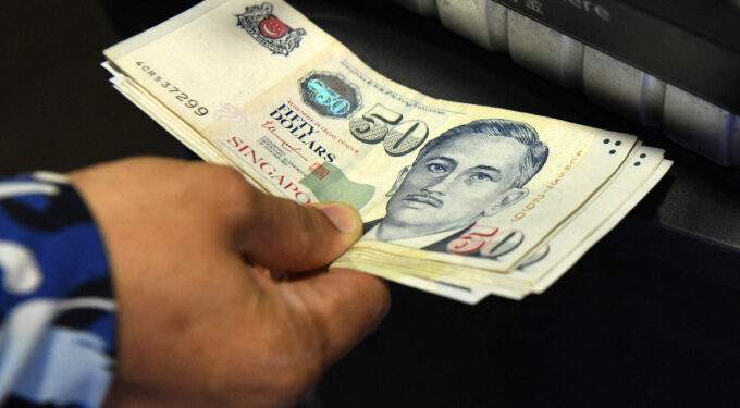 Who appears on all Singapore dollar banknotes?