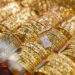 Gold prices narrow morning gains