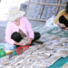 Phụ nữ làng biển Diêm Phố, xã Vạn Lộc, Thanh Hoá sơ chế hải sản, làm công tác hậu cần nghề biển...